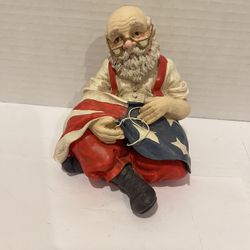 Midwest of Cannon Falls patriotic Santa sewing the US flag figurine. 3” x 4” 