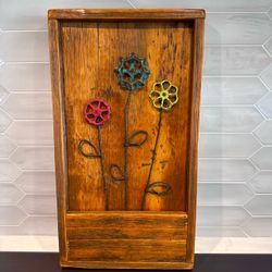 Rustic artisan made flowers wall hanging 21 3/4” tall x 12” wide and 2 1/4” thick Salvaged wood with vintage painted metal faucet handles for the f