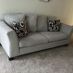 Grey 2 seater couch w pillows 