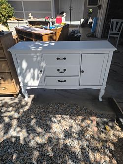 Solid wood freshly sanded and painted three drawer dresser with two storage areas behind doors