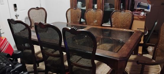 8 Cane back chairs and Dinning room table set with China cabinet 