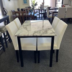 Small Dining Set With Faux Marble Top Table And White Boucle Chairs