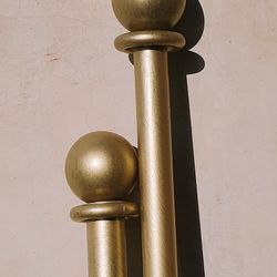 Gently worn brushed gold painted metal curtain rod 10.5 ft