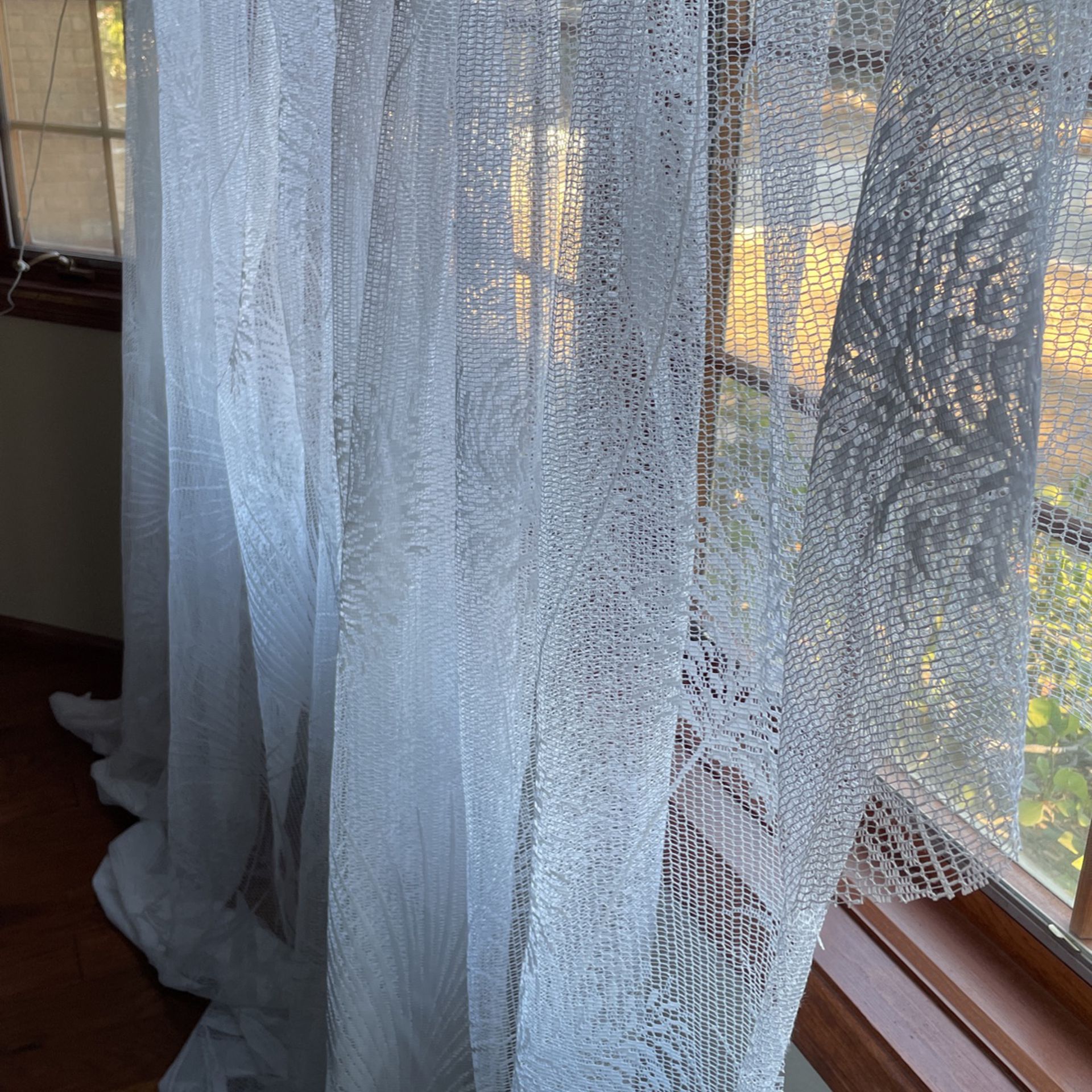  Ruined nylon lace curtain with plastic hooks
