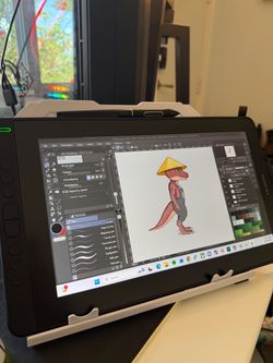 Huion Kamvas 13 1080p drawing tablet with all cords, stand, pen and 10 extra nibs.