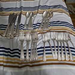 Silver plate 8 piece flatware set with extras