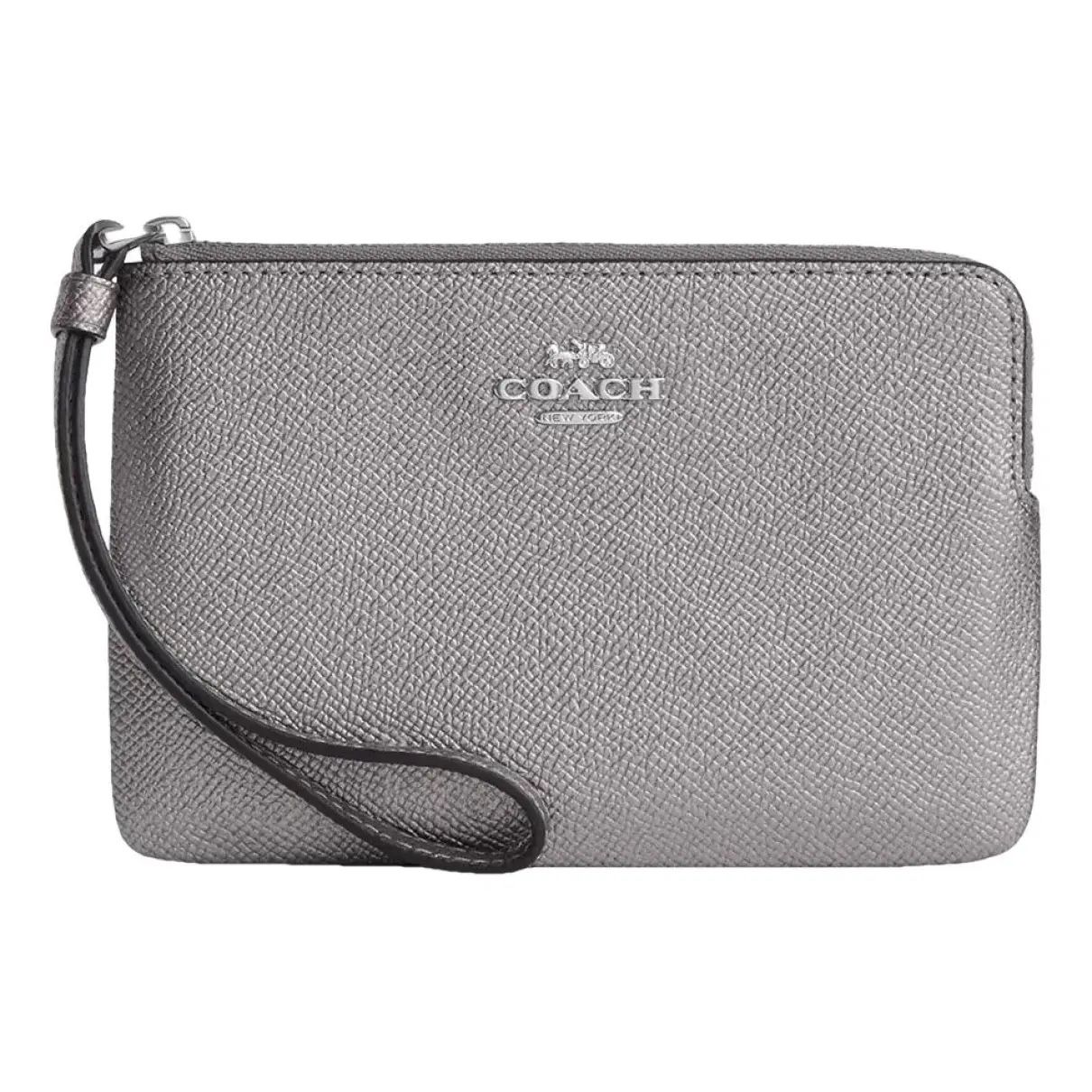 silver metallic coach wristlet