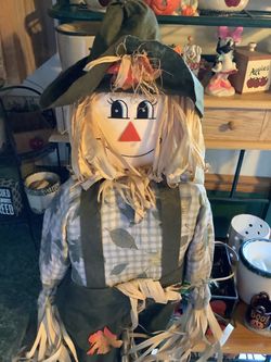 Halloween or Thanksgiving scarecrow stands approximately 60” tall built on a stake excellent condition stake-supported decorative doll featuring a cl