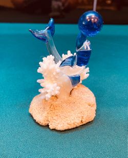 Vintage Murano style glass dolphin on natural white coral