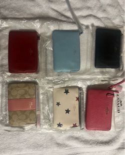 Coach zip up wallets