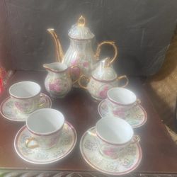 Antique Tea Set Teapot Sugar And Creamer And Four Cups And Saucers 