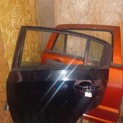 2011 sentra left rear door black 