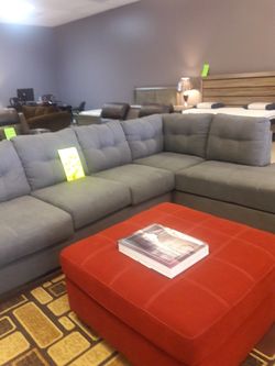 Grey sectional New Sig ashley