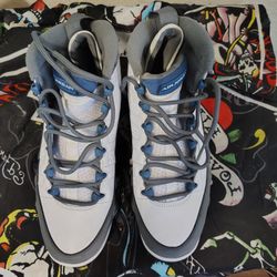 

These are Nike Air Jordan 9 Retro shoes in the "Flint Grey and French Blue" colorway. 
Dive deeper in AI Mode