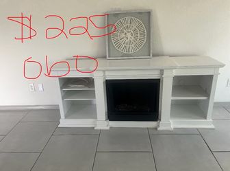 White electric fireplace/TV stand