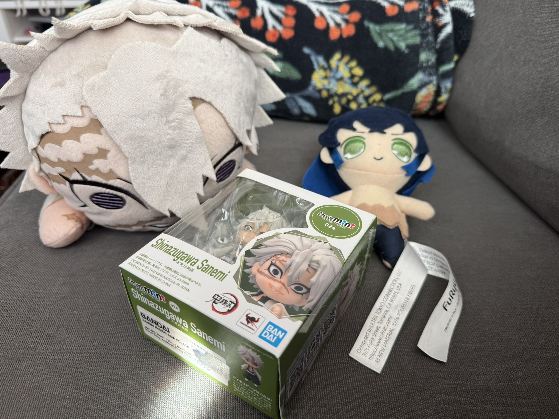 Demon Slayer Plushie And A Collectible Figure 