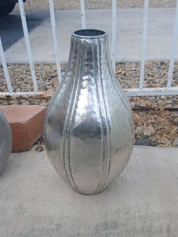 silver-toned aluminum vase