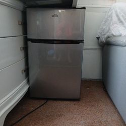 Apartment Sized Refrigerator With Seperate Freezer.