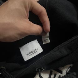 burberry sweater has a couple holes other then that is in good condition 100 % real