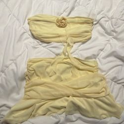 Yellow strapless top with flower detail With matching skirt