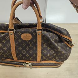 Vintage Style Louis Vuitton Sac Sport duffle bag featuring the classic monogram canvas, vachetta leather trim, and a distinct lower zippered compartme