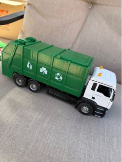Bruder MAN TGS rear loading garbage truck.