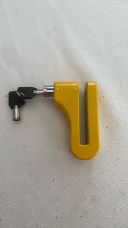 This is a bright yellow motorcycle disc lock, designed to immobilize the wheel by fitting through the brake https://offerup.com/redirect/?o=ZGlzYy5JdA
