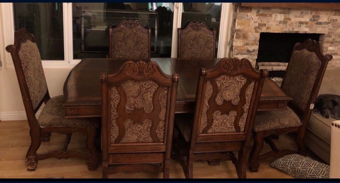 large brown dining table from room to go