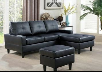 Black leather sectional and ottoman