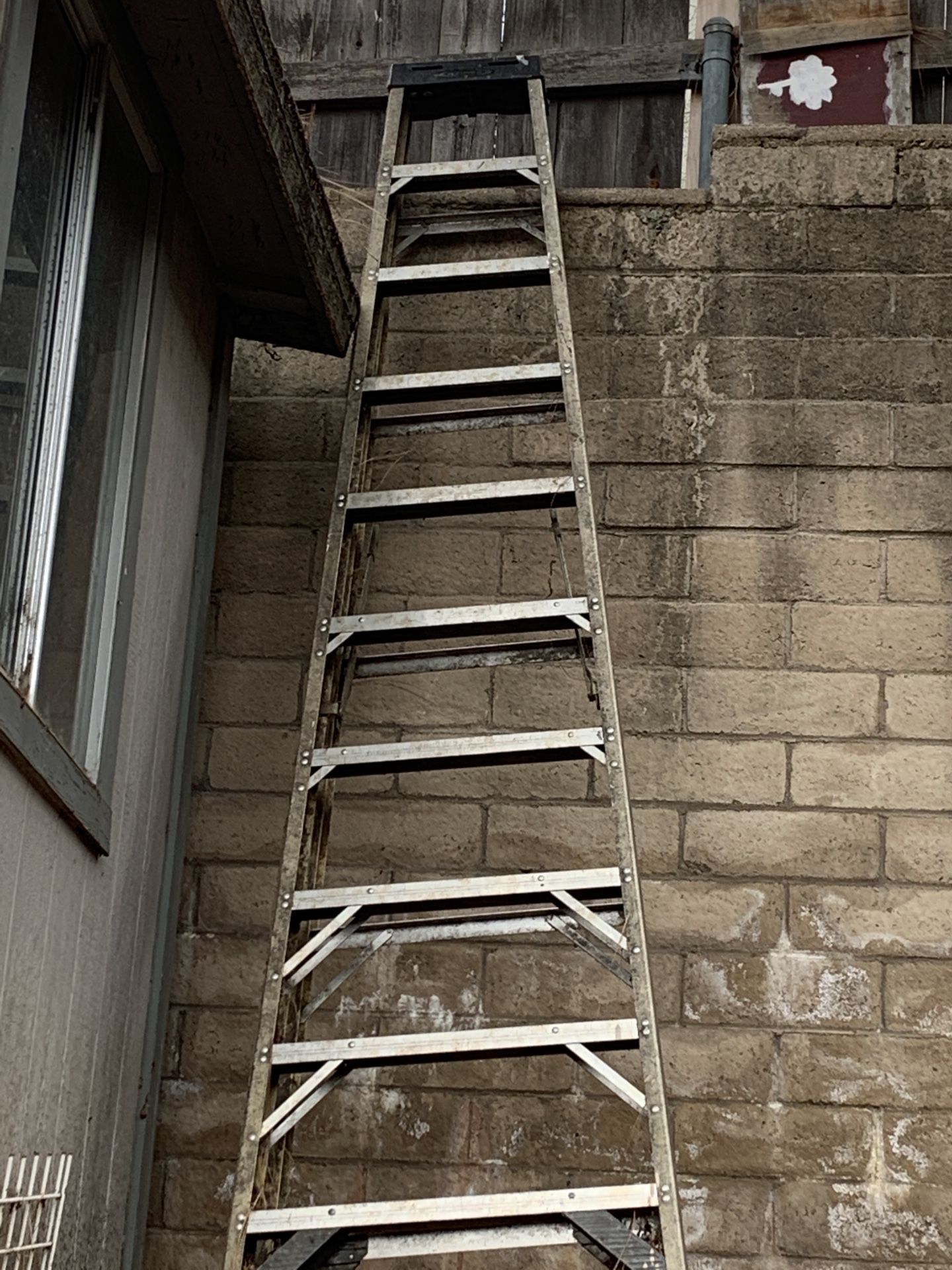 Ladders 28’ extension with leg levelers brackets,12' twin step ladders $245