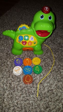 Kids toy dinosaur eating teaching taking game