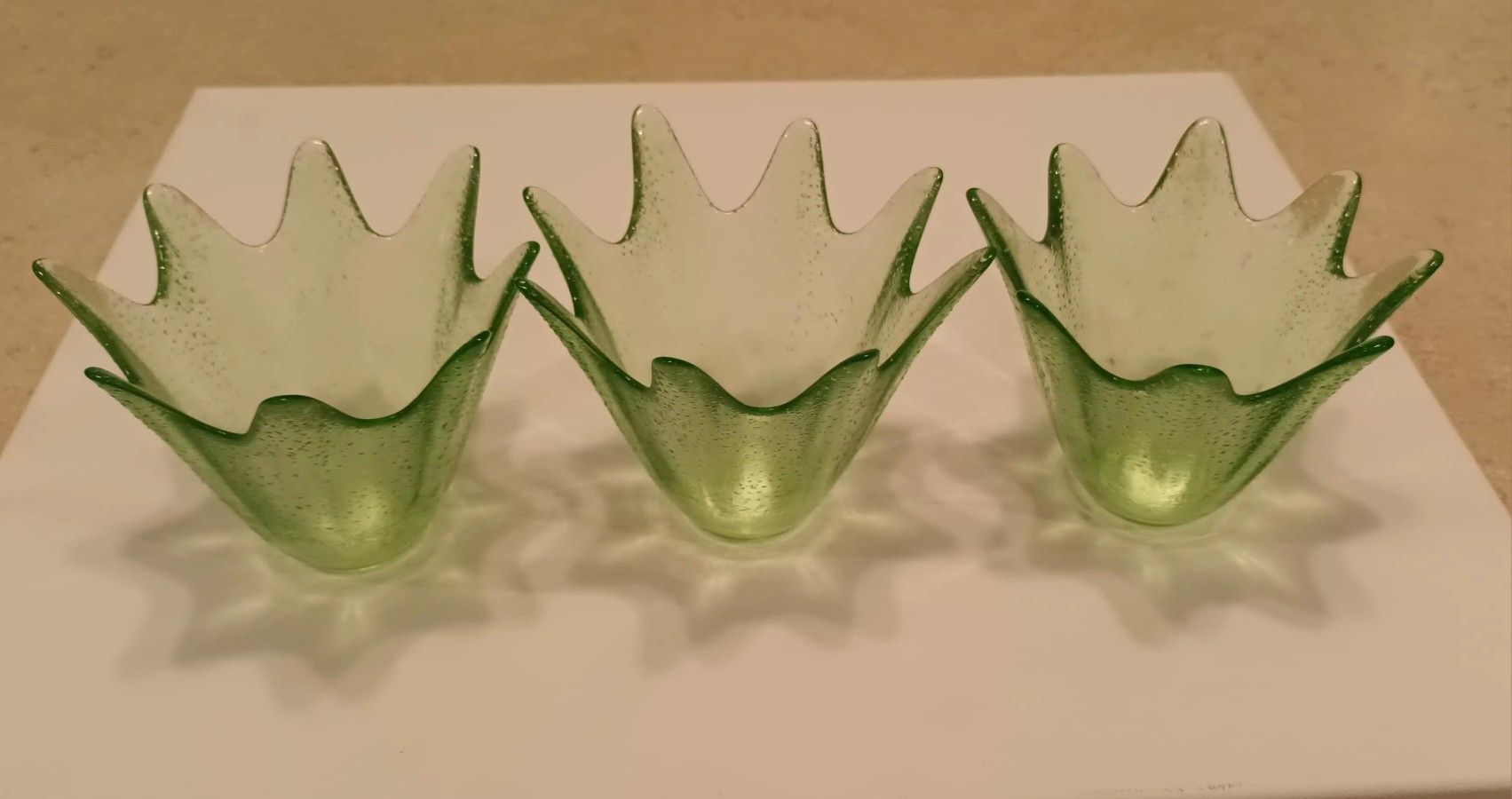 A Set Of 3 Unique Shape Green Glass Candle Holders