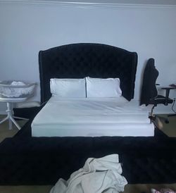 Black upholstered king bed frame