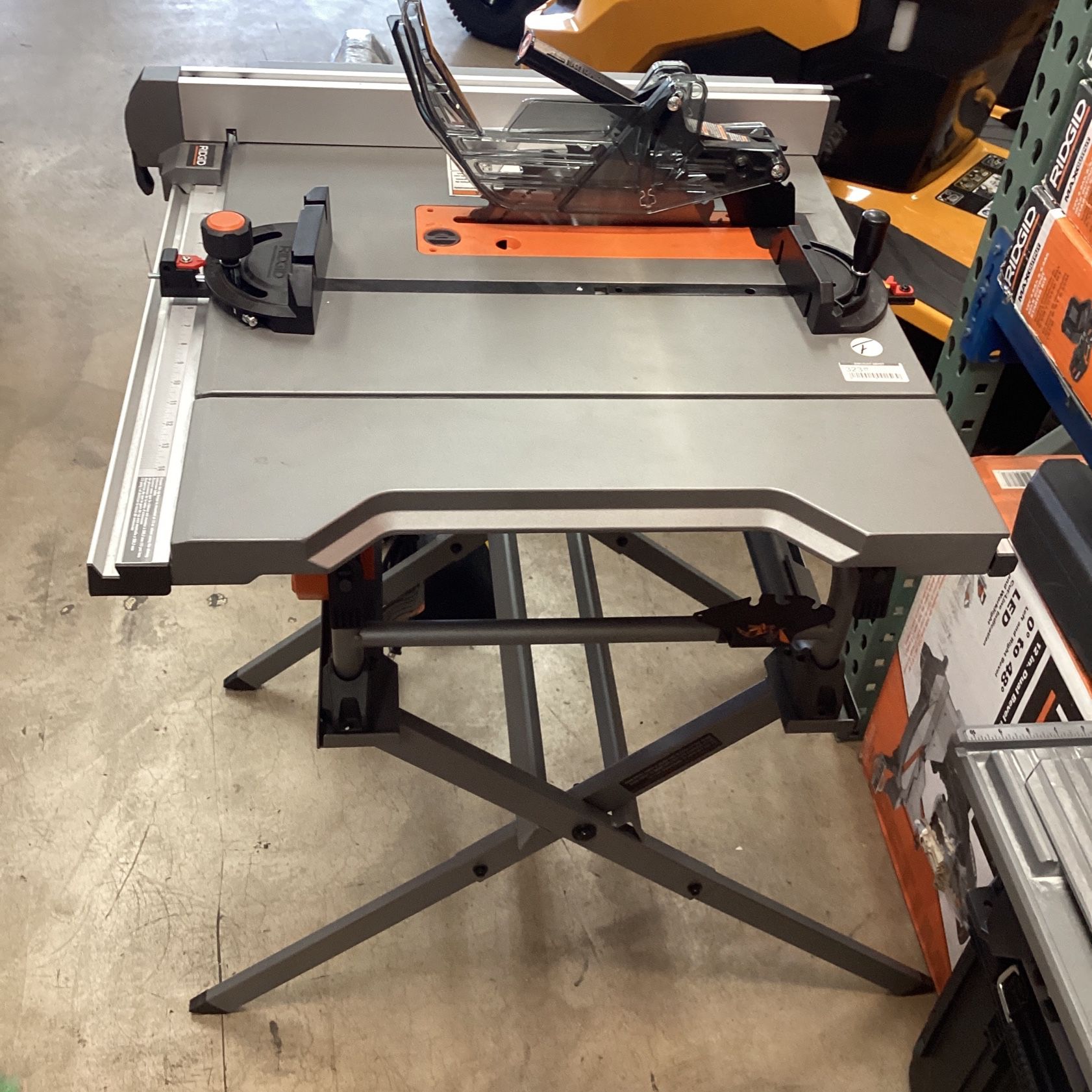 (New) RIDGID R4518 15 Amp 10 in. Table Saw with Folding Stand