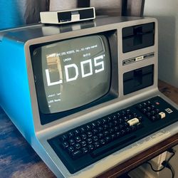 Working TRS-80 Model III 48K RAM with hard drive emulator.