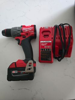 Milwaukee M18 fuel brushless 1/2" drill/driver with 5.0AH battery and charger.
