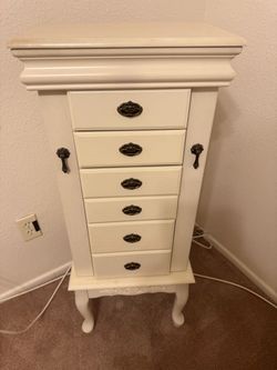 Jewelry armoire white wood side doors , pink lined drawers,  mirror