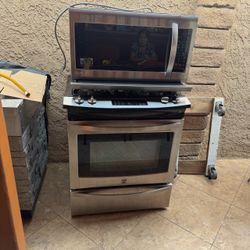 Kenmore Stainless Steel Gas Range and microwave with vent