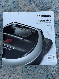Powerful Samsung POWERbot R7065 robot vacuum is a silver and black cleaning device with Wi-Fi connectivity