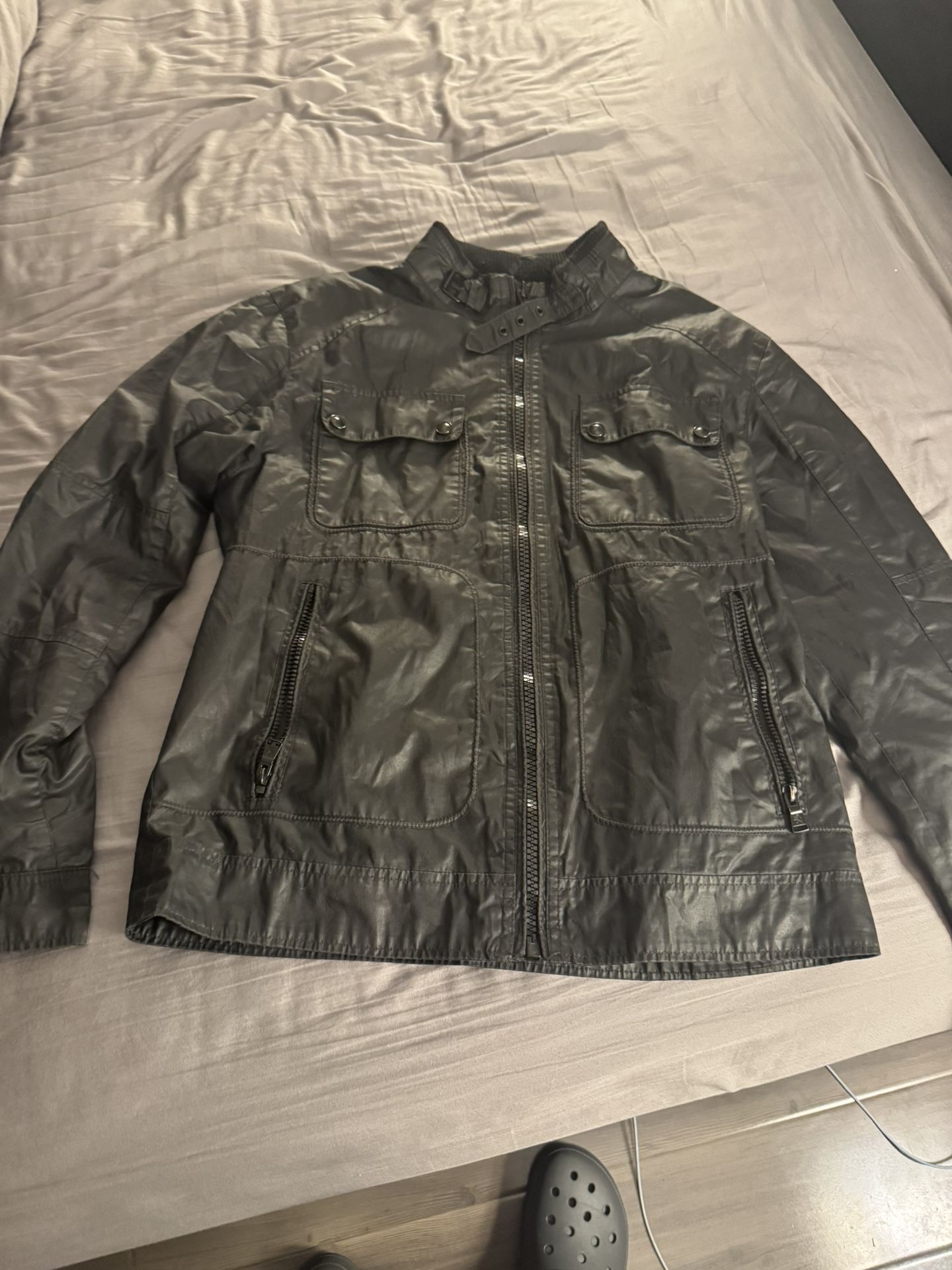 Express Waxed Cotton Mens Racing Jacket. Mens size: M. Black Waxed Cotton. Button and Zipper closures.