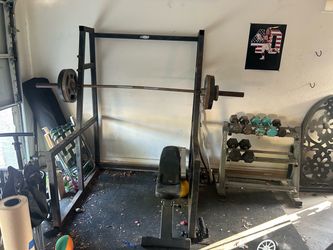 Dumbbells, plate weights, squat rack and more