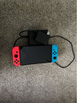 Switch with cords and Smash Bros Ultimate