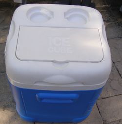 Blue and white Igloo Ice Cube cooler with cup holders.