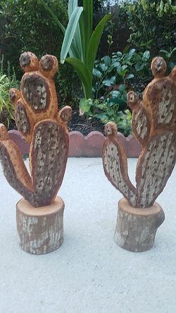 Pair of log carved cactuses