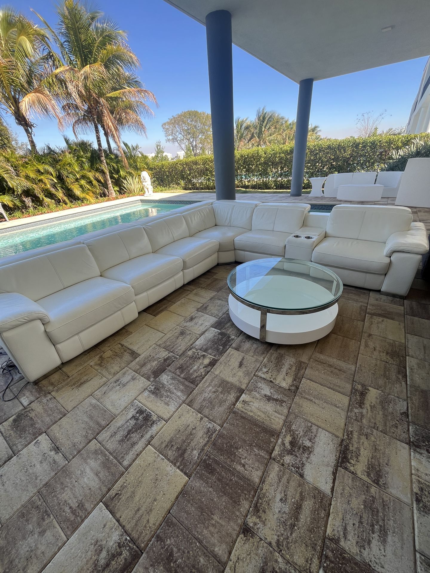 White couch with black chairs