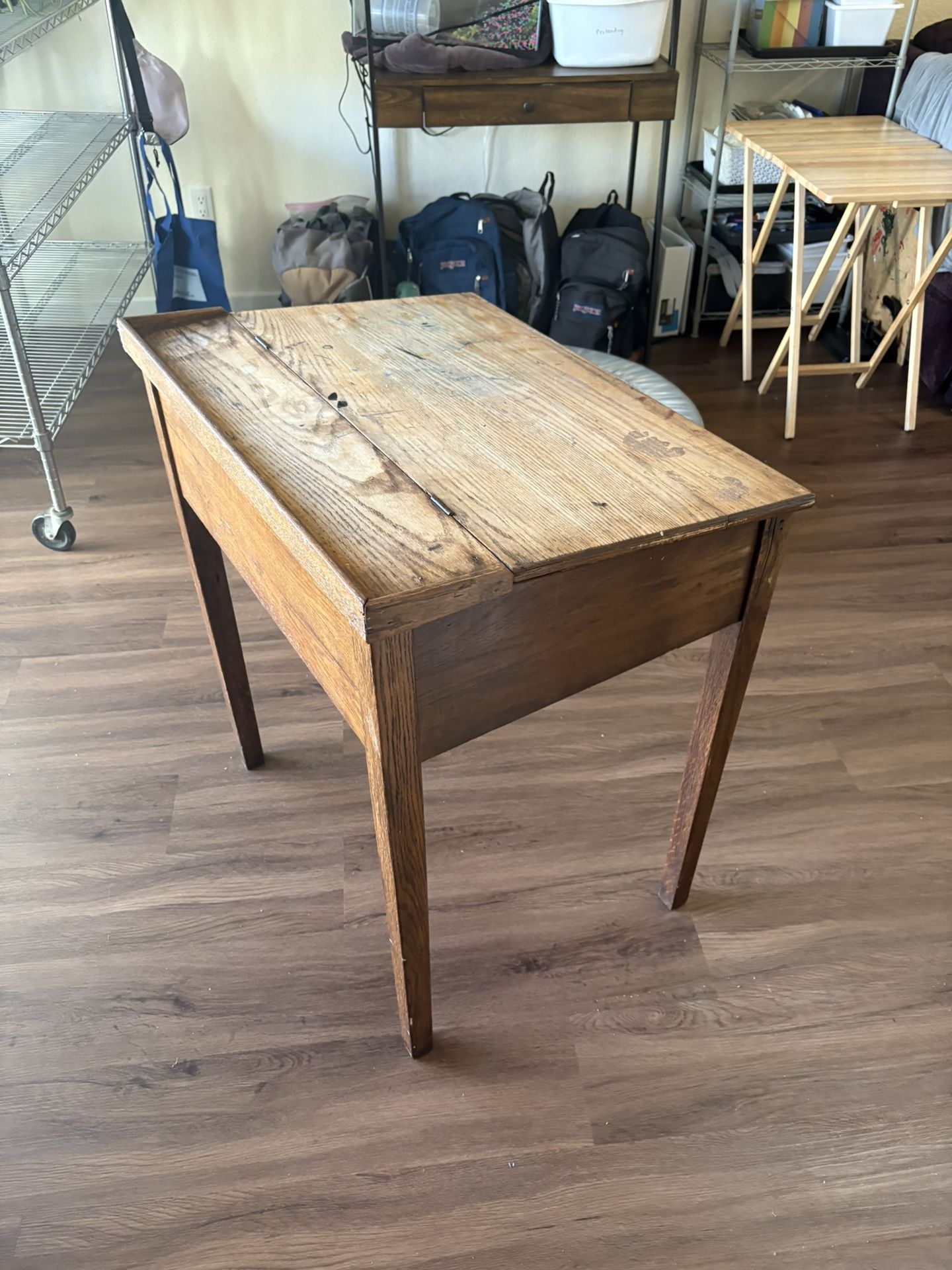 Wooden desk with storage under lid 