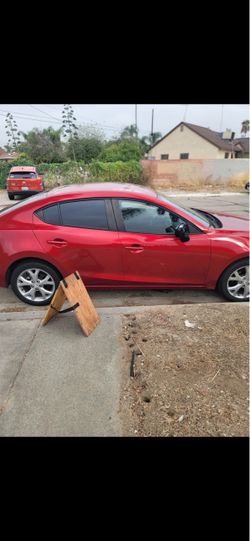 Red Mazda 3 Sedan