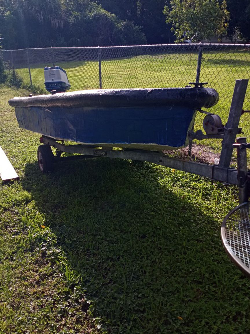 Photo 11 Foot home made boat motor and trailer