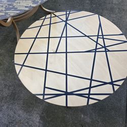 Modern round side table/credenza with gold legs.