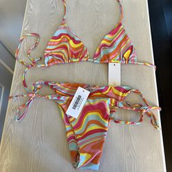 Let's get tanned Tangerine Swirl bikini set   Top size large by PLUMERIA SWIMWEAR